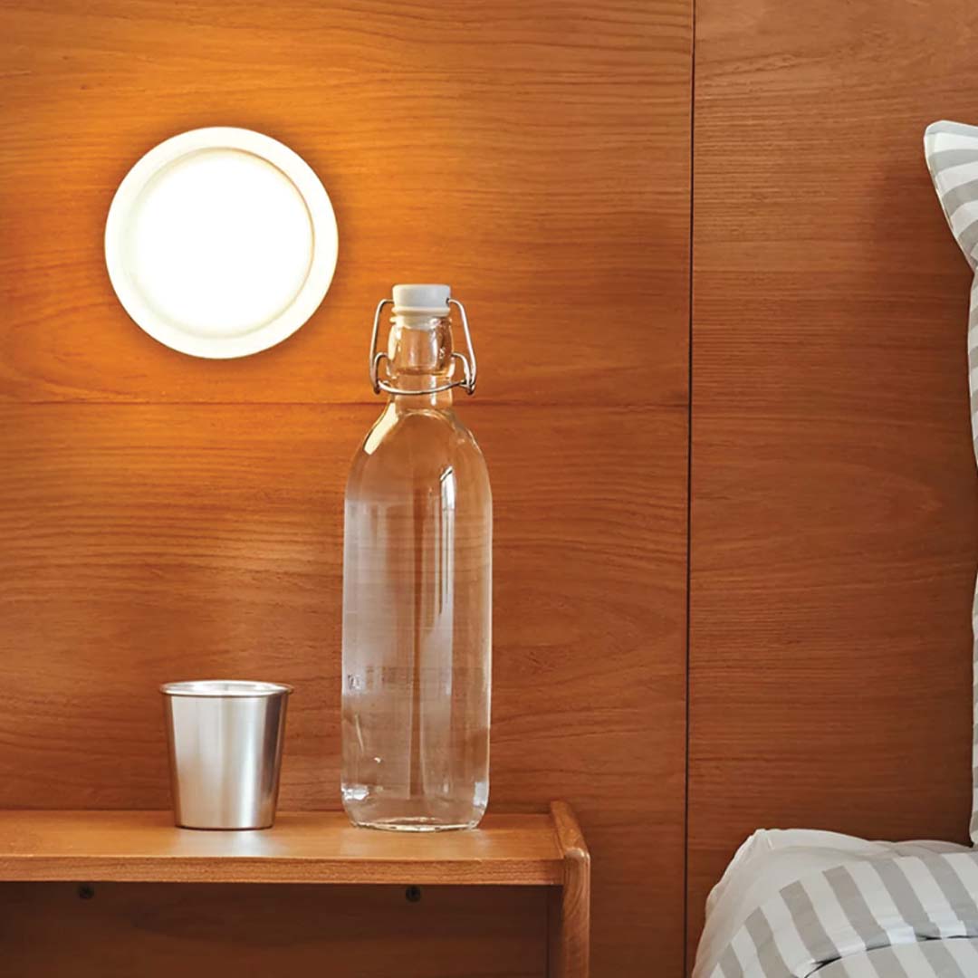 BowLift | LumièreLux: Sophisticated Dimple Wall Lamp Crafted from Metal and Glass