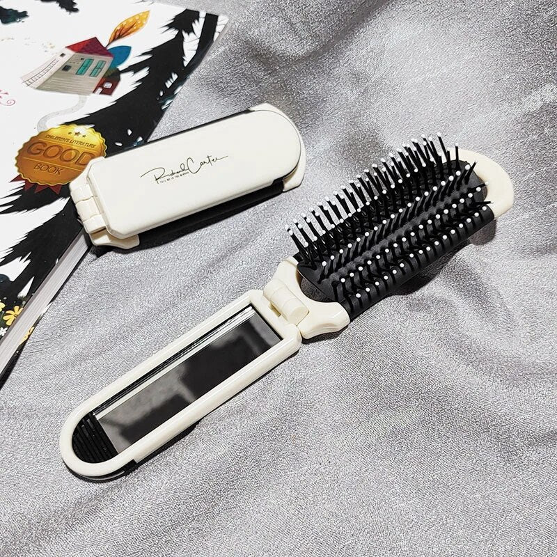 Compact hairbrush with integrated mirror | Bowlift